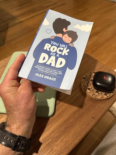 Jonathan Eastman holding his copy of the Dad guide