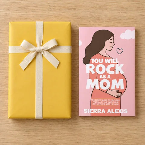 Everything in The Pregnancy Box, laid out on a wooden table