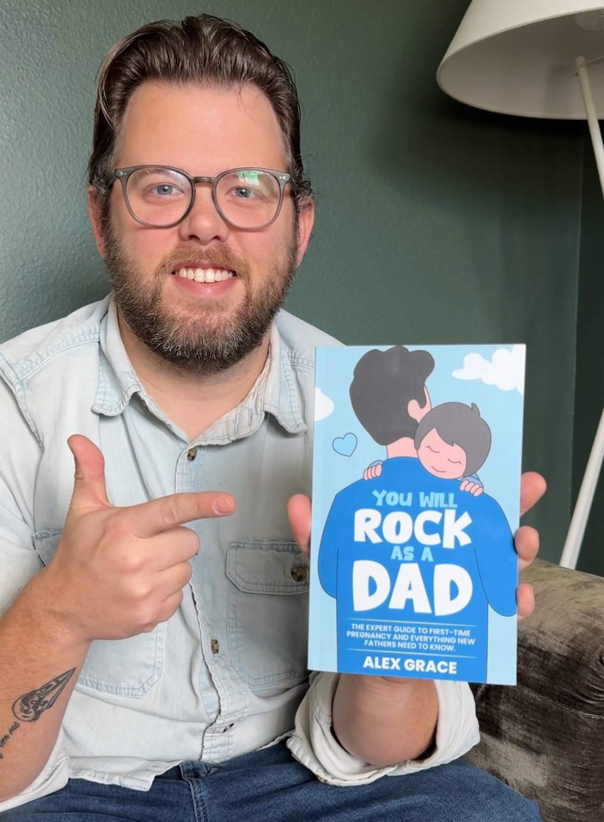 Reader holding a copy of You Will Rock As a Dad!